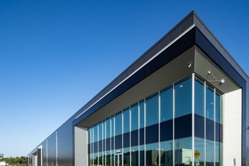 Contemporary industrial building with a glazed corner entrance