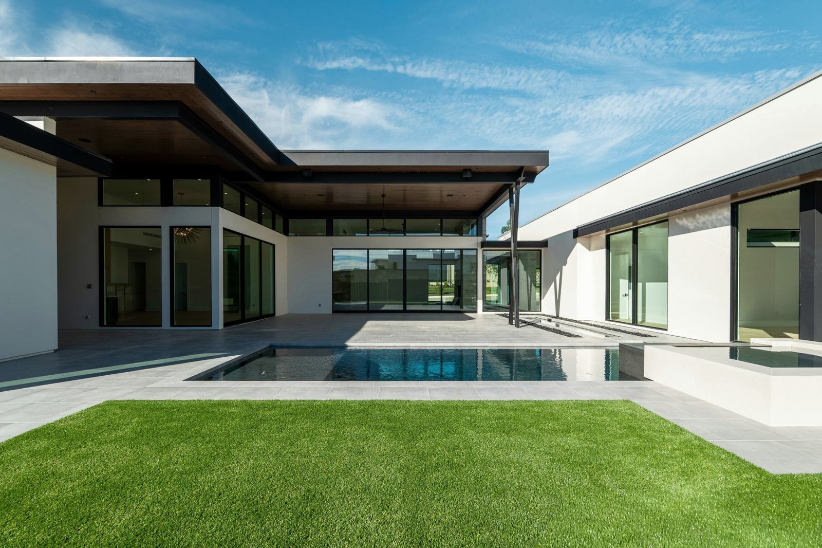 Contemporary single-story residence around a courtyard pool